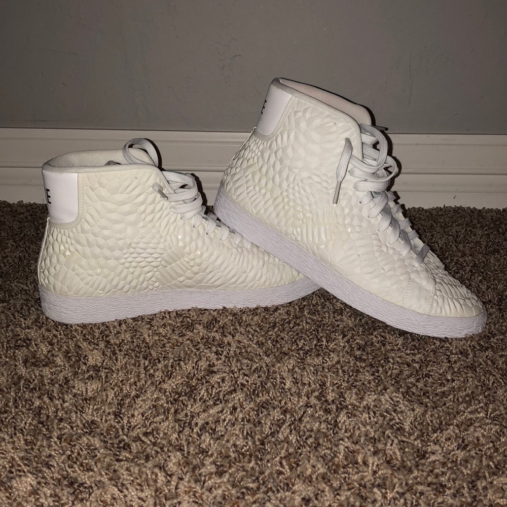 Custom white Nike high tops.